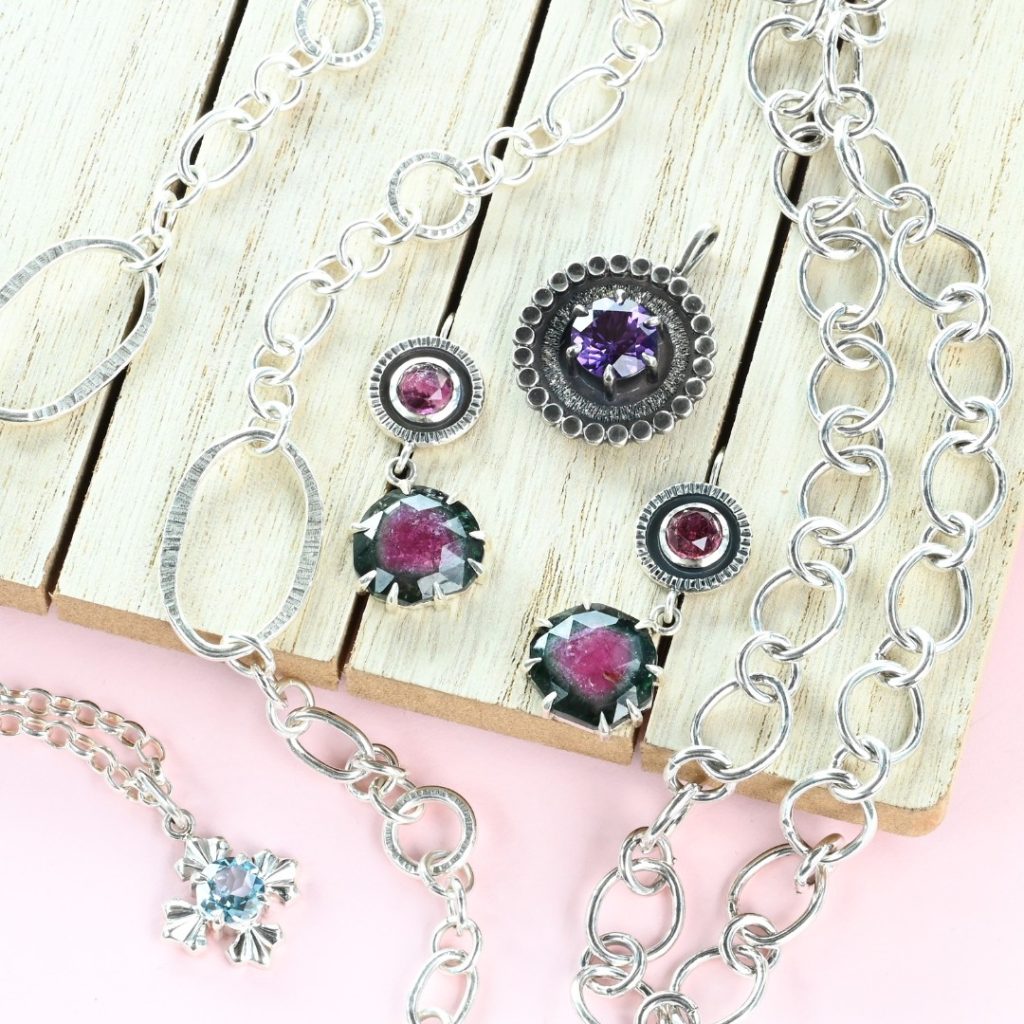 Silver chains with prong set gemstones in handmade jewellery