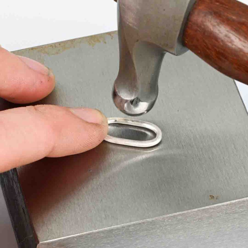 Adding texture to handmade chain links with a ball peen hammer