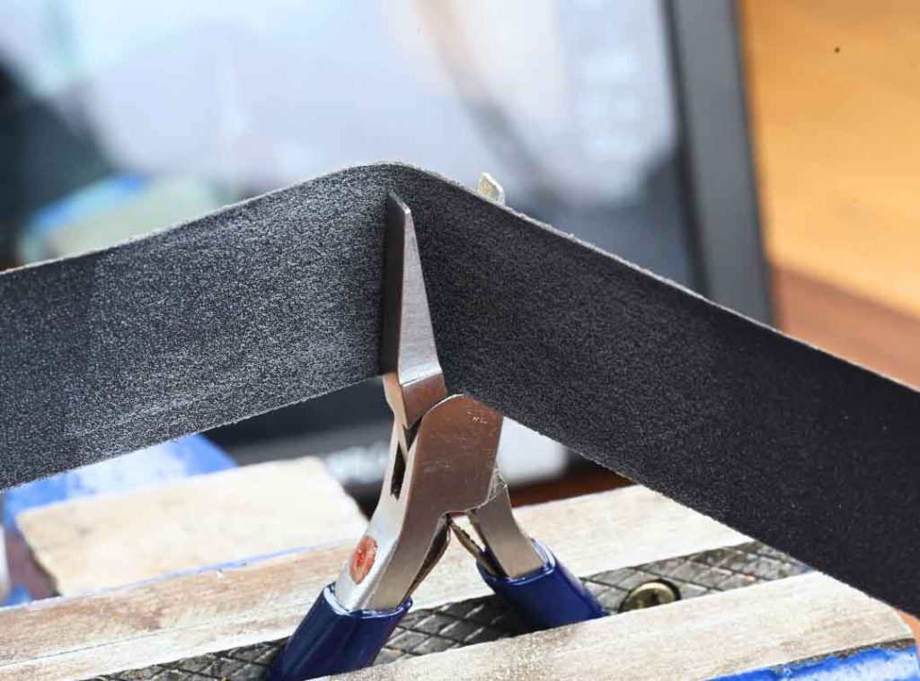 Using sandpaper to modify pliers for jewellery making