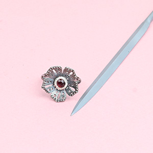 barette needle file for jewellers and metalsmiths with handmade silver flower ring with a tourmaline center stone